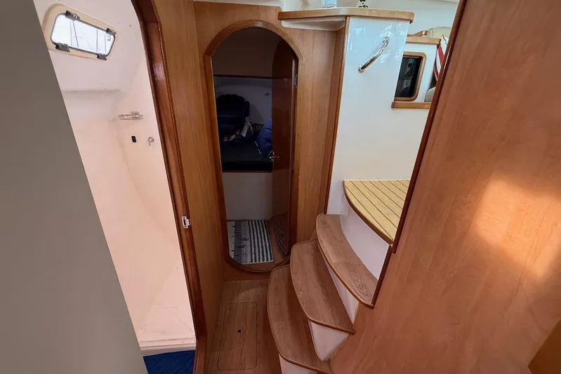 Zimbini Yacht Photos Pics Interior of 2006 Island Spirit 401 yacht with wooden steps and cabin entrance.