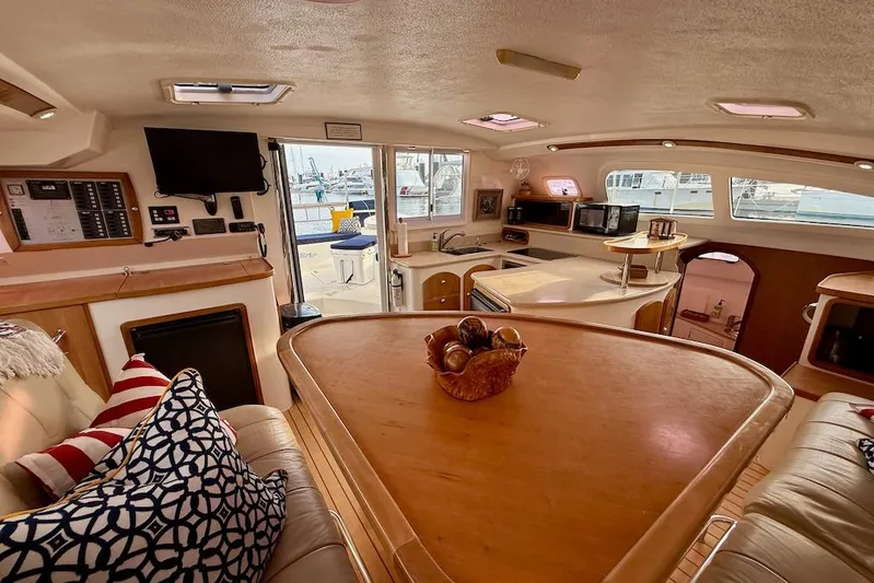 Zimbini Yacht Photos Pics Luxurious interior of 2006 Island Spirit 401 yacht with modern amenities and cozy seating.