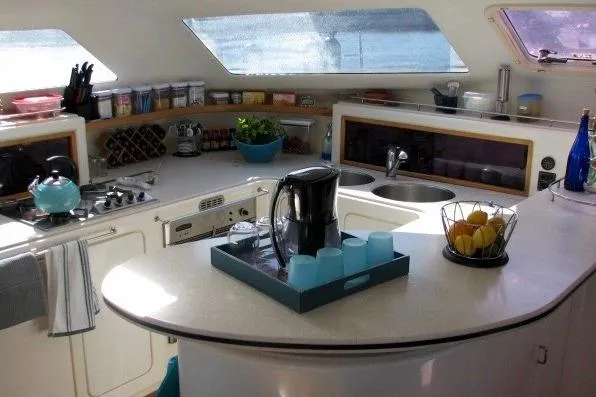 Turquoise Turtle Yacht Photos Pics Spacious kitchen in 2001 Voyage 500 yacht with modern amenities and natural light.