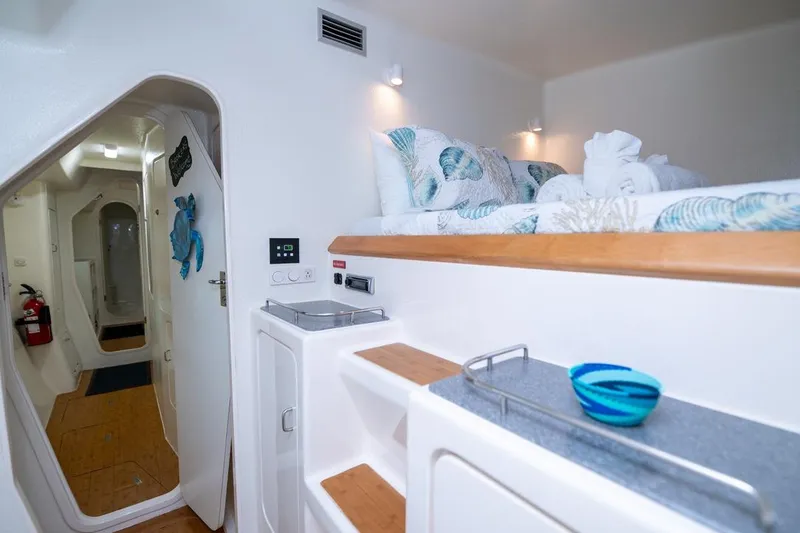 Turquoise Turtle Yacht Photos Pics Interior of 2001 Voyage 500 yacht with cozy bed and modern amenities.