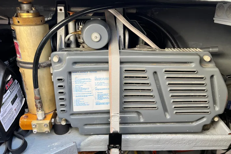 Turquoise Turtle Yacht Photos Pics Engine compartment of a 2001 Voyage 500, featuring mechanical components and instructions.