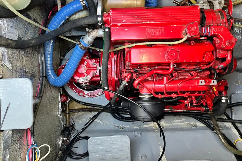 Turquoise Turtle Yacht Photos Pics Red engine in a 2001 Voyage 500 boat, featuring hoses and wiring.