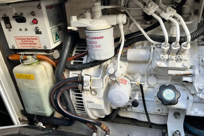 Turquoise Turtle Yacht Photos Pics Engine compartment of a 2001 Voyage 500, featuring fuel filter and wiring.