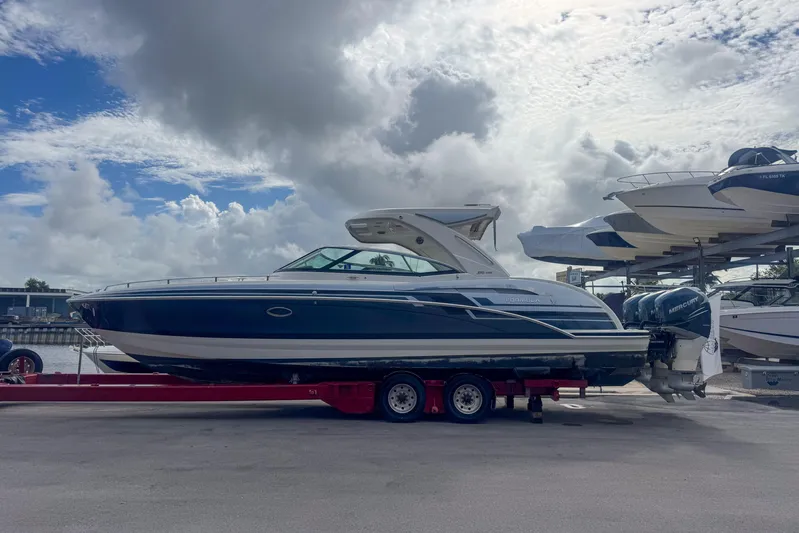  Yacht Photos Pics 2021 Formula 350 Crossover Bowrider OB on trailer under cloudy sky.