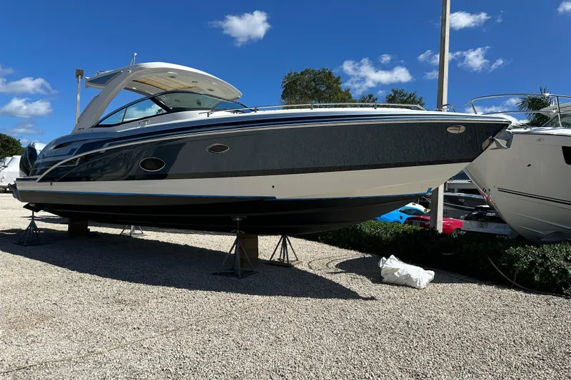  Yacht Photos Pics 2021 Formula 350 Crossover Bowrider OB on display under clear blue sky.
