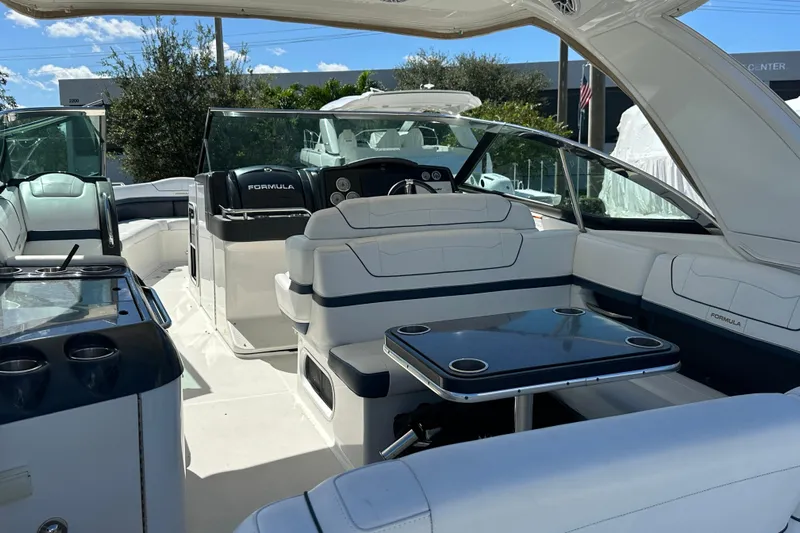  Yacht Photos Pics 2021 Formula 350 Crossover Bowrider OB interior with seating and table, showcasing luxury design.