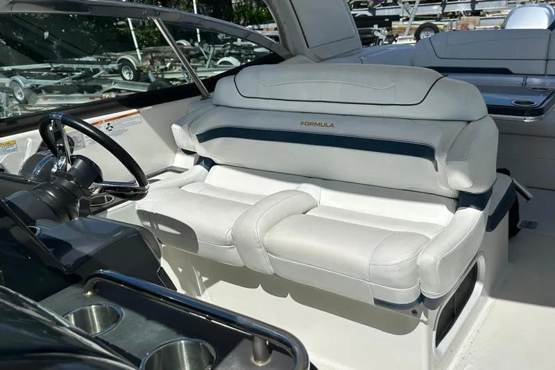  Yacht Photos Pics 2021 Formula 350 Crossover Bowrider OB interior with white leather seating and steering wheel.