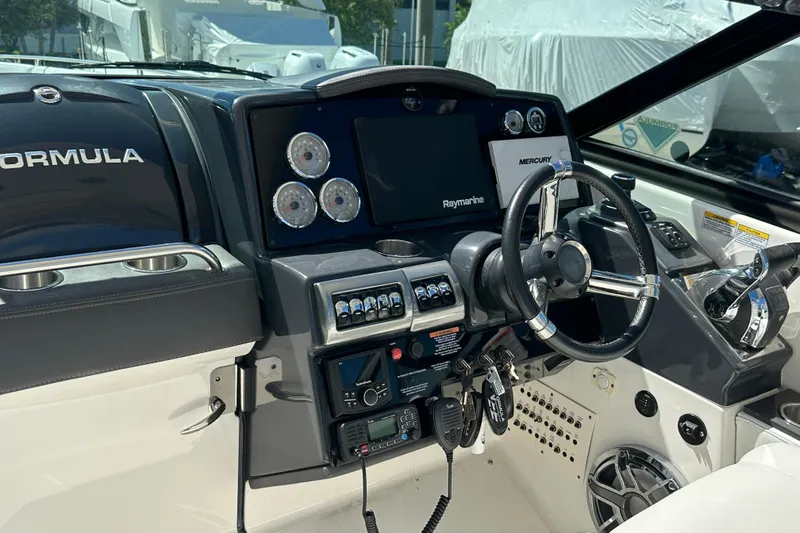  Yacht Photos Pics 2021 Formula 350 Crossover Bowrider OB dashboard with steering wheel and control panel.