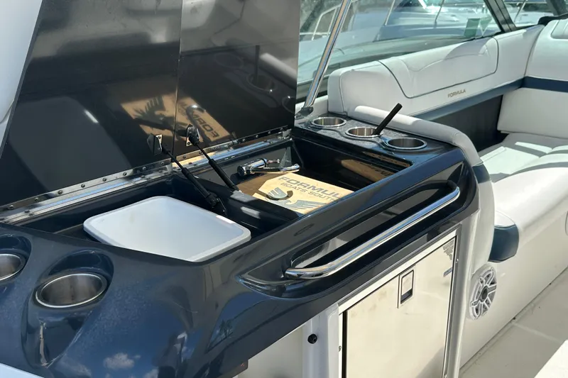  Yacht Photos Pics 2021 Formula 350 Crossover Bowrider OB interior with kitchenette and seating area.