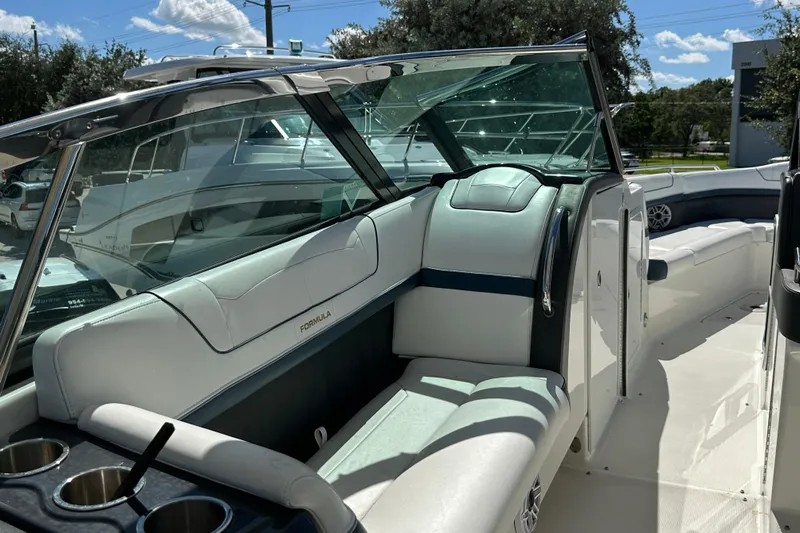  Yacht Photos Pics 2021 Formula 350 Crossover Bowrider OB interior with luxurious seating and cup holders.