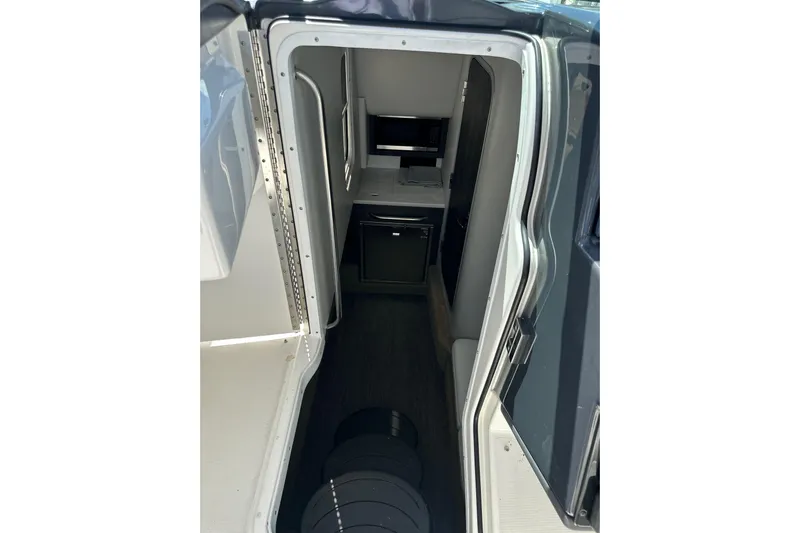  Yacht Photos Pics Interior view of 2021 Formula 350 Crossover Bowrider OB cabin, featuring compact design.