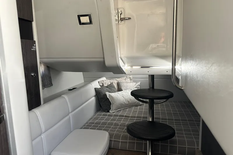 Yacht Photos Pics 2021 Formula 350 Crossover Bowrider OB cabin interior with seating and bedding.