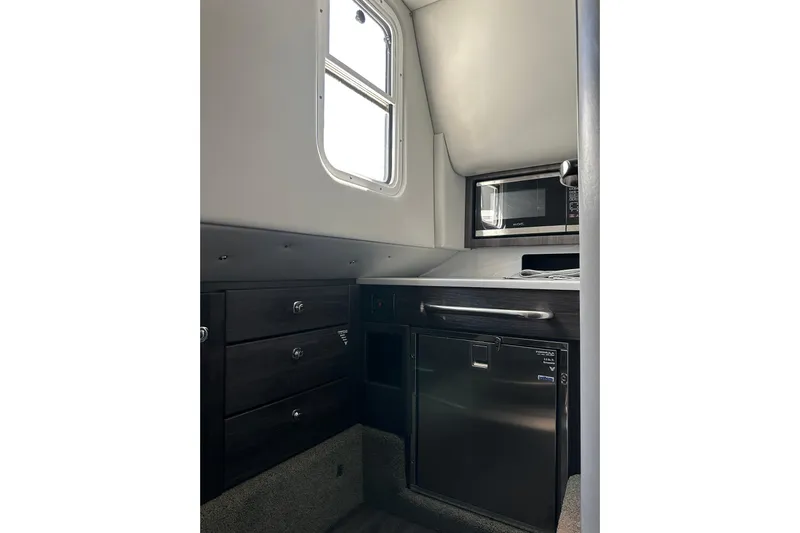  Yacht Photos Pics Interior of 2021 Formula 350 Crossover Bowrider OB with kitchenette and storage.