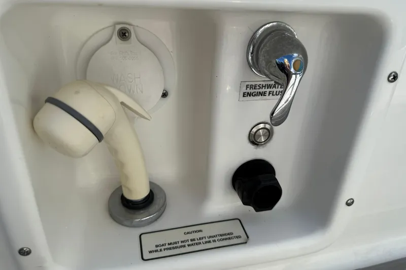  Yacht Photos Pics 2021 Formula 350 Crossover Bowrider OB washdown and freshwater engine flush controls.