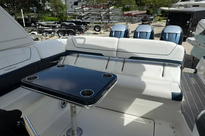  Yacht Photos Pics 2021 Formula 350 Crossover Bowrider OB interior with seating and table, showcasing luxury design.