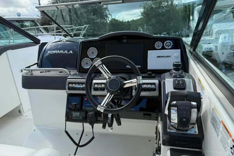  Yacht Photos Pics 2021 Formula 350 Crossover Bowrider OB helm with steering wheel and control panel.