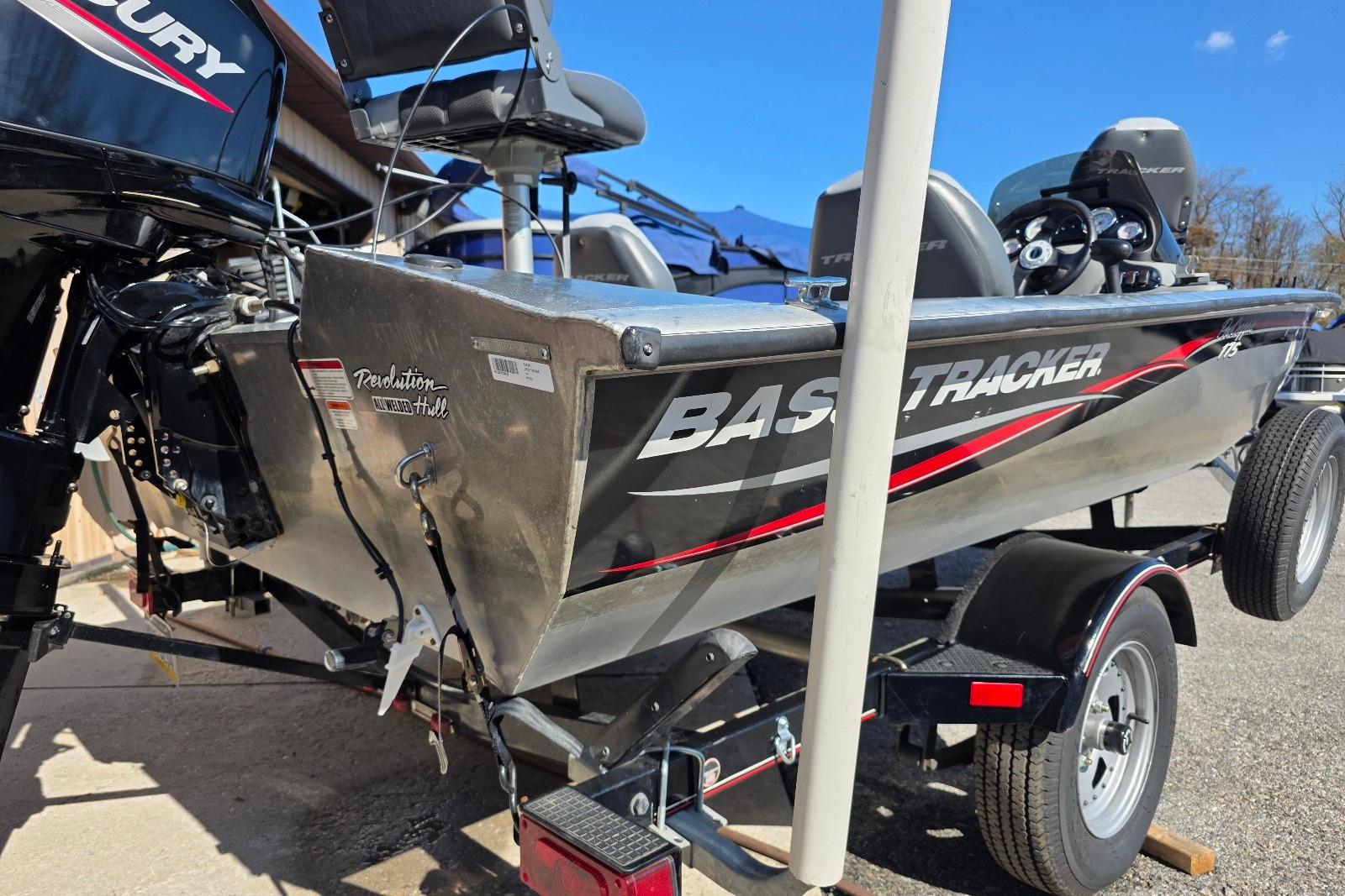 2010 Bass Tracker Pro Crappie 175 boat on trailer, featuring Mercury outboard motor.