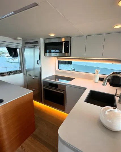  Yacht Photos Pics Modern kitchen interior of 2023 CL Yachts CLB65 with sleek appliances and elegant design.