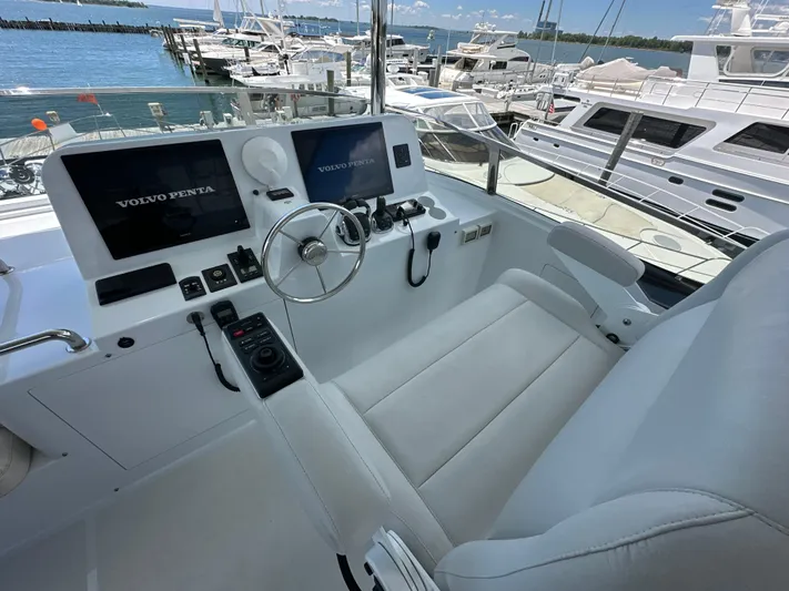  Yacht Photos Pics Helm of 2023 CL Yachts CLB65 with Volvo Penta controls, docked at marina.