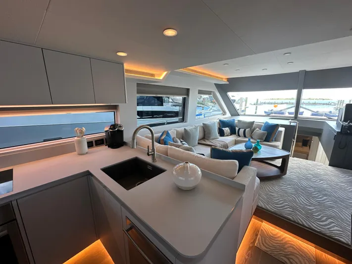  Yacht Photos Pics Luxurious interior of 2023 CL Yachts CLB65 with modern kitchen and cozy seating area.