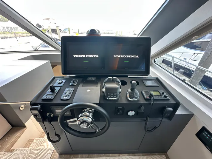  Yacht Photos Pics Helm station of 2023 CL Yachts CLB65 with dual Volvo Penta displays.
