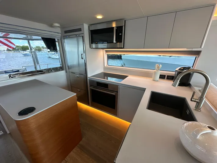  Yacht Photos Pics Modern kitchen interior of 2023 CL Yachts CLB65 with sleek design and waterfront view.