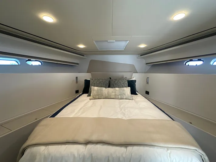  Yacht Photos Pics Luxurious 2023 CL Yachts CLB65 cabin interior with elegant bedding and ambient lighting.