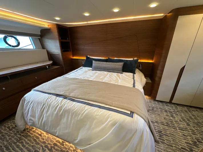  Yacht Photos Pics Luxurious bedroom interior of 2023 CL Yachts CLB65 with modern design and ambient lighting.