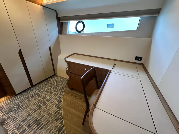  Yacht Photos Pics Luxurious interior of 2023 CL Yachts CLB65 with elegant desk and window view.