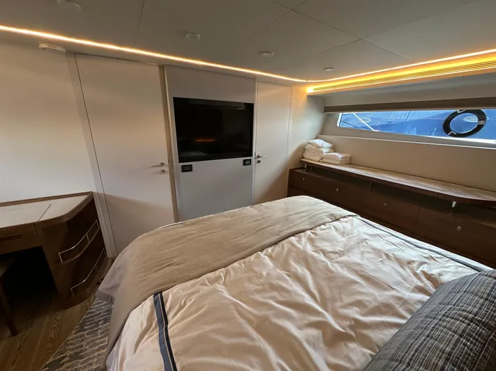  Yacht Photos Pics Luxurious bedroom interior of 2023 CL Yachts CLB65 with modern design and elegant furnishings.
