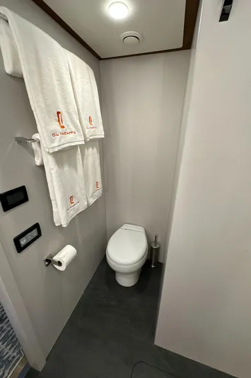  Yacht Photos Pics 2023 CL Yachts CLB65 bathroom with modern fixtures and branded towels.