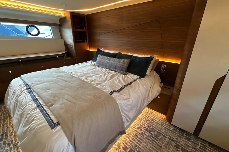  Yacht Photos Pics Luxurious bedroom interior of 2023 CL Yachts CLB65 with modern design and ambient lighting.