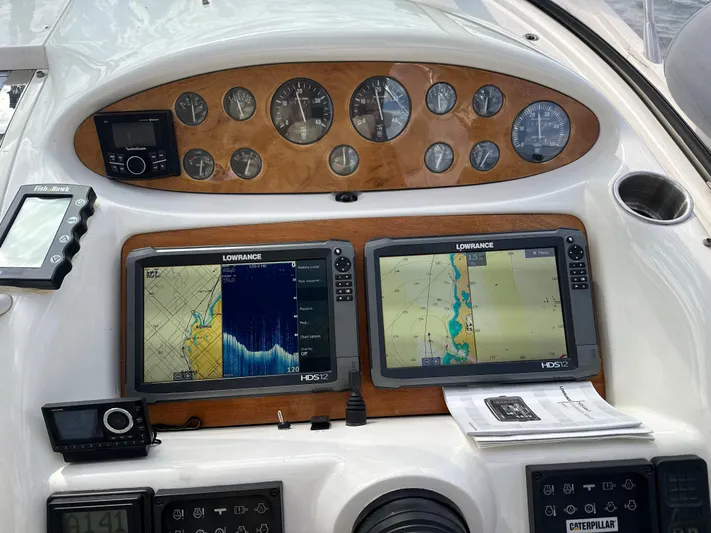  Yacht Photos Pics 1997 Sunseeker Camargue dashboard with navigation screens and control instruments.