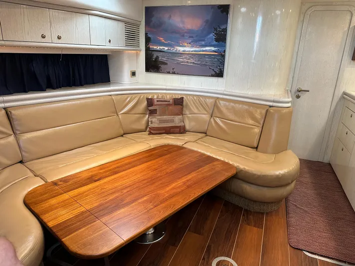  Yacht Photos Pics Luxurious interior of a 1997 Sunseeker Camargue yacht with leather seating and wooden table.