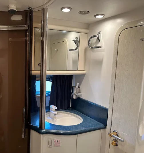  Yacht Photos Pics Bathroom interior of 1997 Sunseeker Camargue yacht with sink and mirror.