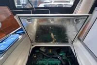 Engine compartment of a 1999 Nimbus 380 Carisma boat, showcasing the engine and interior details.