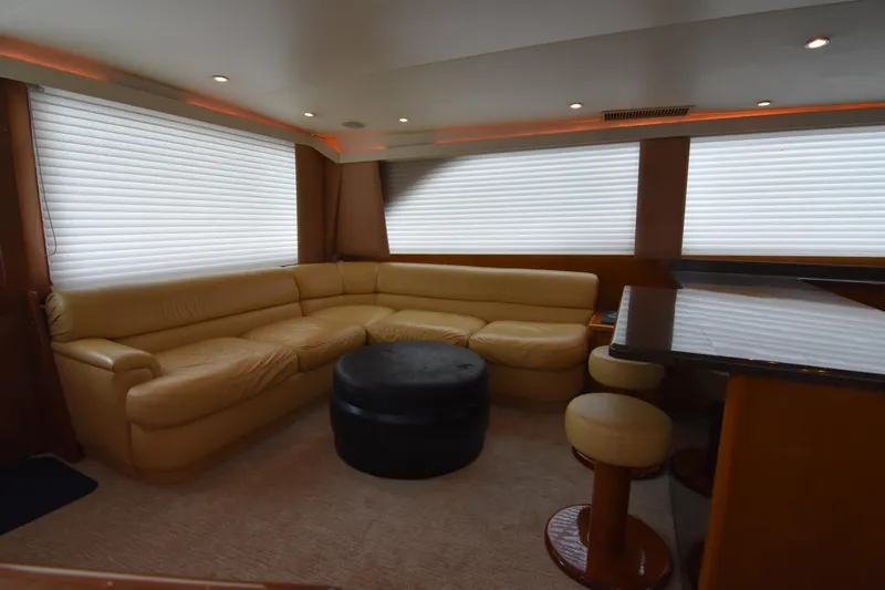 Legacy Yacht Photos Pics Luxurious interior of 1999 Viking 58 Convertible yacht with leather seating and modern decor.