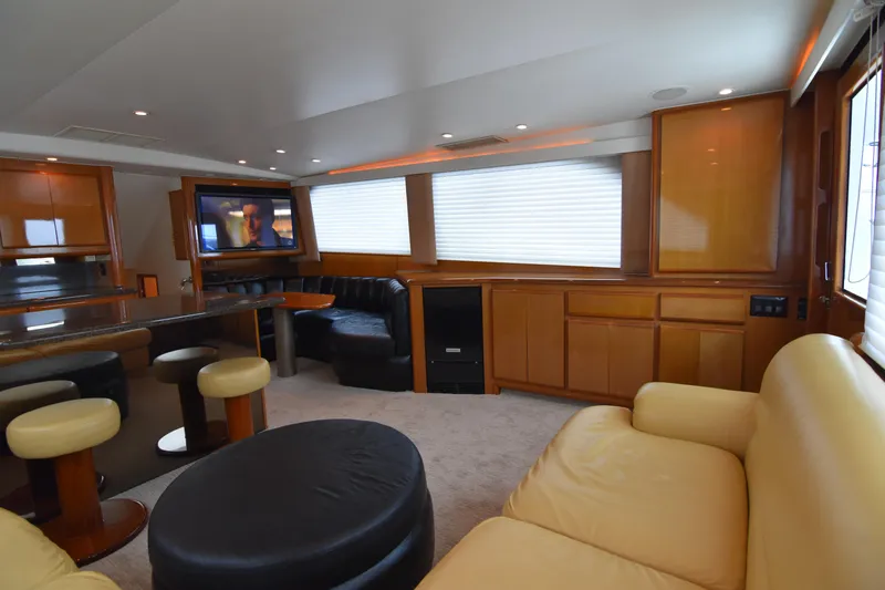 Legacy Yacht Photos Pics Luxurious interior of 1999 Viking 58 Convertible yacht with leather seating and entertainment system.