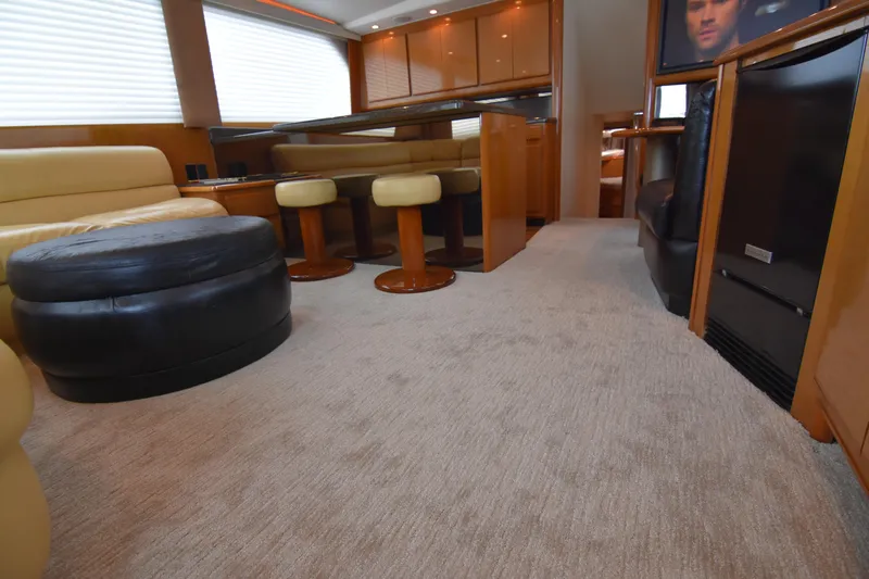 Legacy Yacht Photos Pics Luxurious interior of a 1999 Viking 58 Convertible yacht with plush seating and modern amenities.