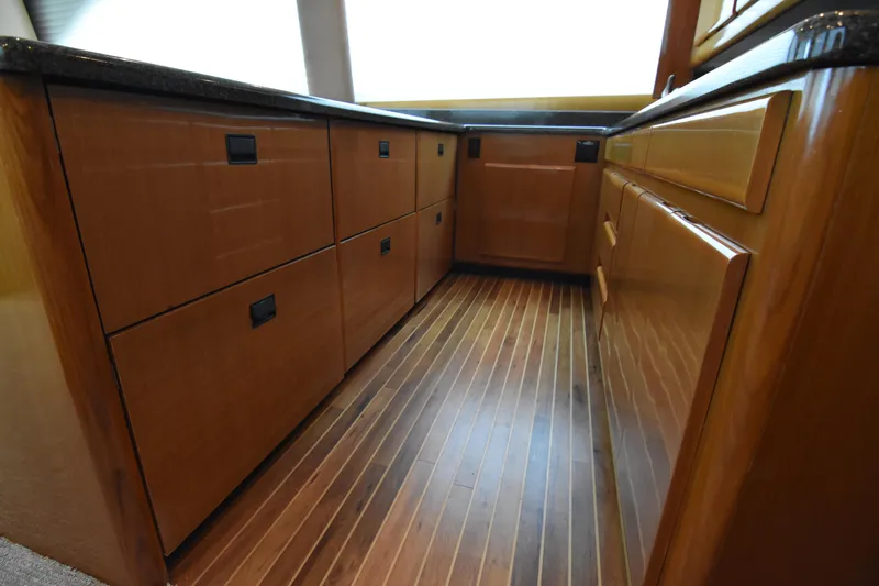 Legacy Yacht Photos Pics Luxurious wooden cabinetry in 1999 Viking 58 Convertible yacht interior.