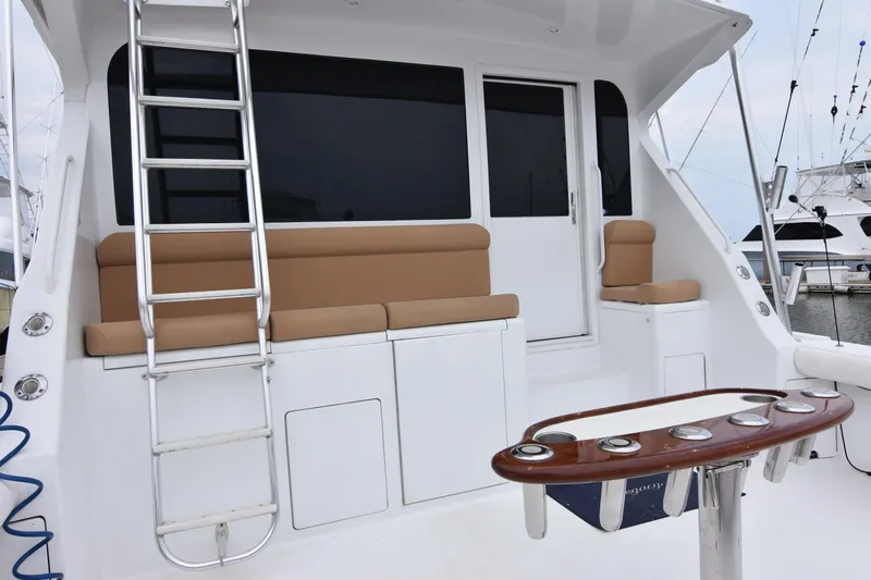 Legacy Yacht Photos Pics 1999 Viking 58 Convertible yacht deck with seating and ladder.