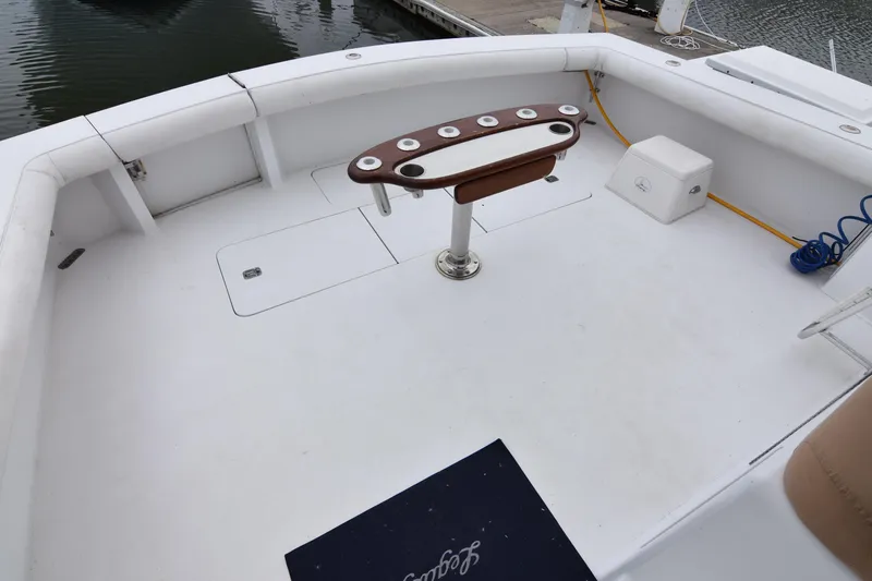 Legacy Yacht Photos Pics Spacious deck of 1999 Viking 58 Convertible yacht with fishing rod holders.