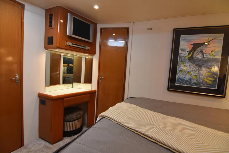 Legacy Yacht Photos Pics Luxurious interior of 1999 Viking 58 Convertible yacht with elegant decor and artwork.