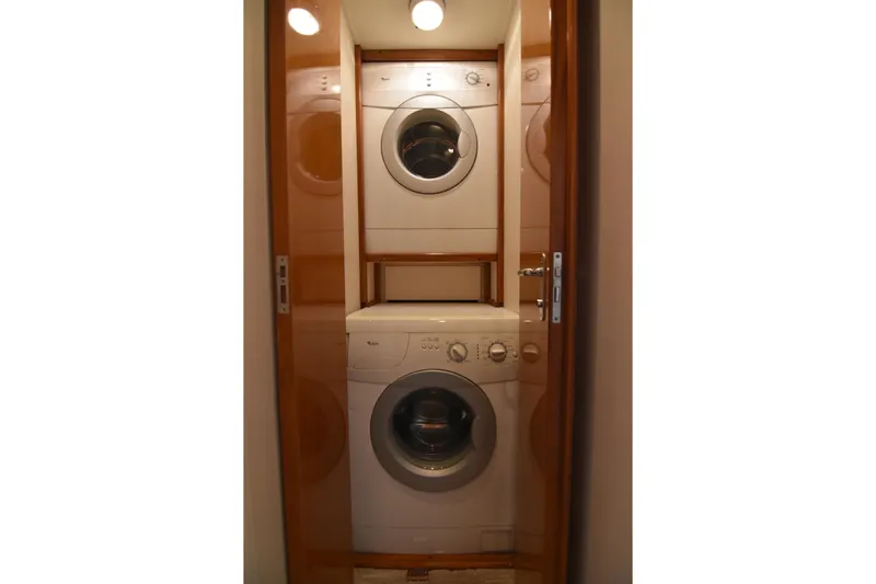 Legacy Yacht Photos Pics Stacked washer and dryer inside 1999 Viking 58 Convertible yacht.
