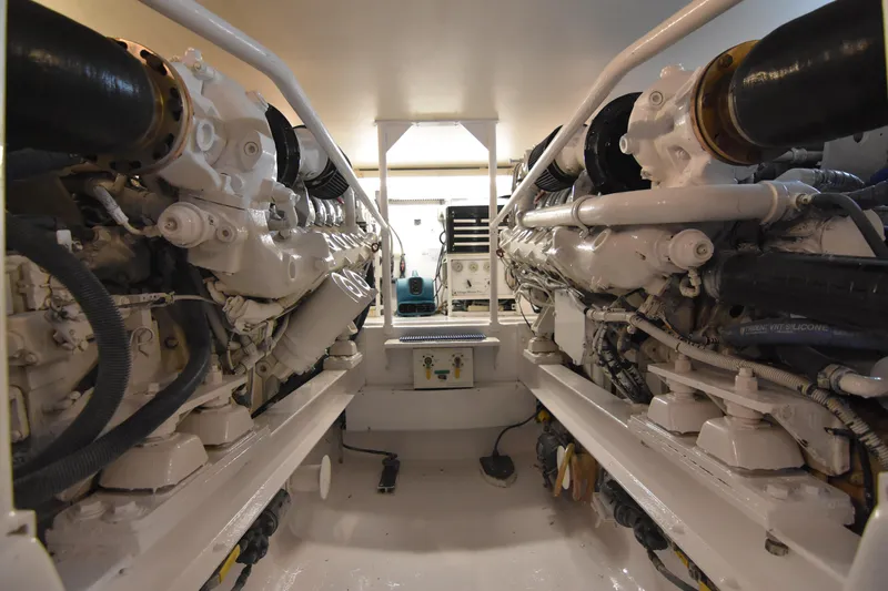 Legacy Yacht Photos Pics Engine room of a 1999 Viking 58 Convertible yacht, showcasing dual engines.