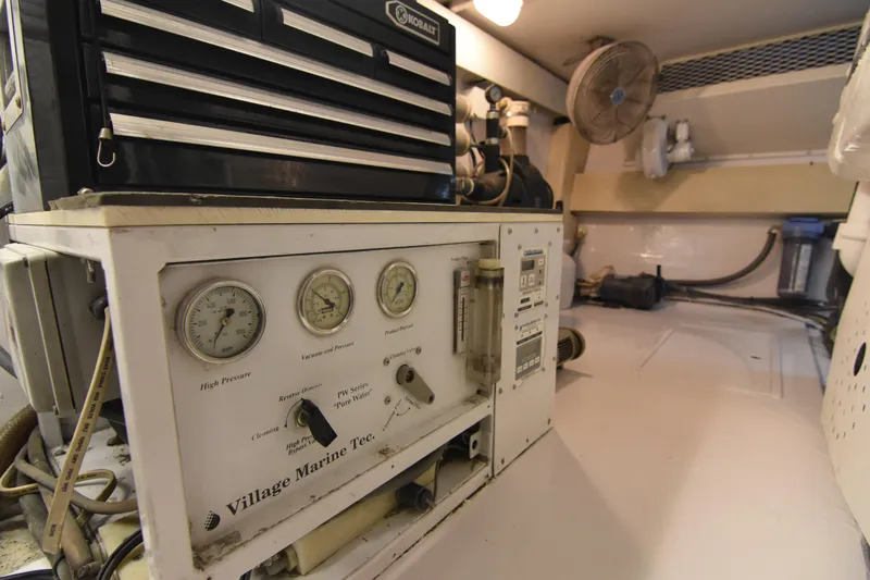 Legacy Yacht Photos Pics Engine room of 1999 Viking 58 Convertible with marine equipment and gauges.