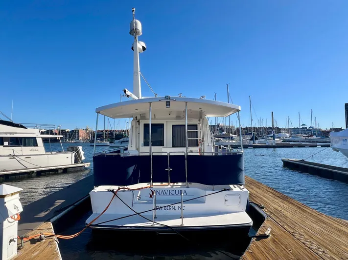  Yacht Photos Pics 2008 Island Pilot 435 yacht docked at marina under clear blue sky.