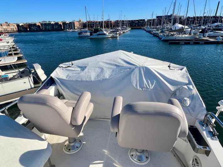  Yacht Photos Pics 2008 Island Pilot 435 yacht with covered helm, docked in a marina.