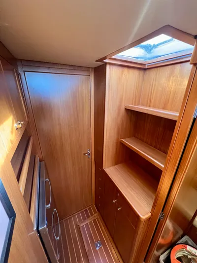  Yacht Photos Pics 2008 Island Pilot 435 interior with wooden cabinetry and skylight.