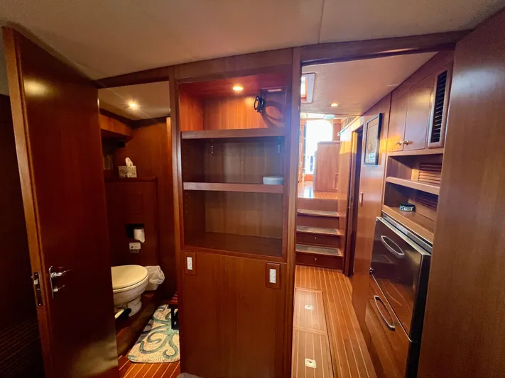  Yacht Photos Pics Interior of 2008 Island Pilot 435 yacht, featuring wooden cabinetry and a compact bathroom.